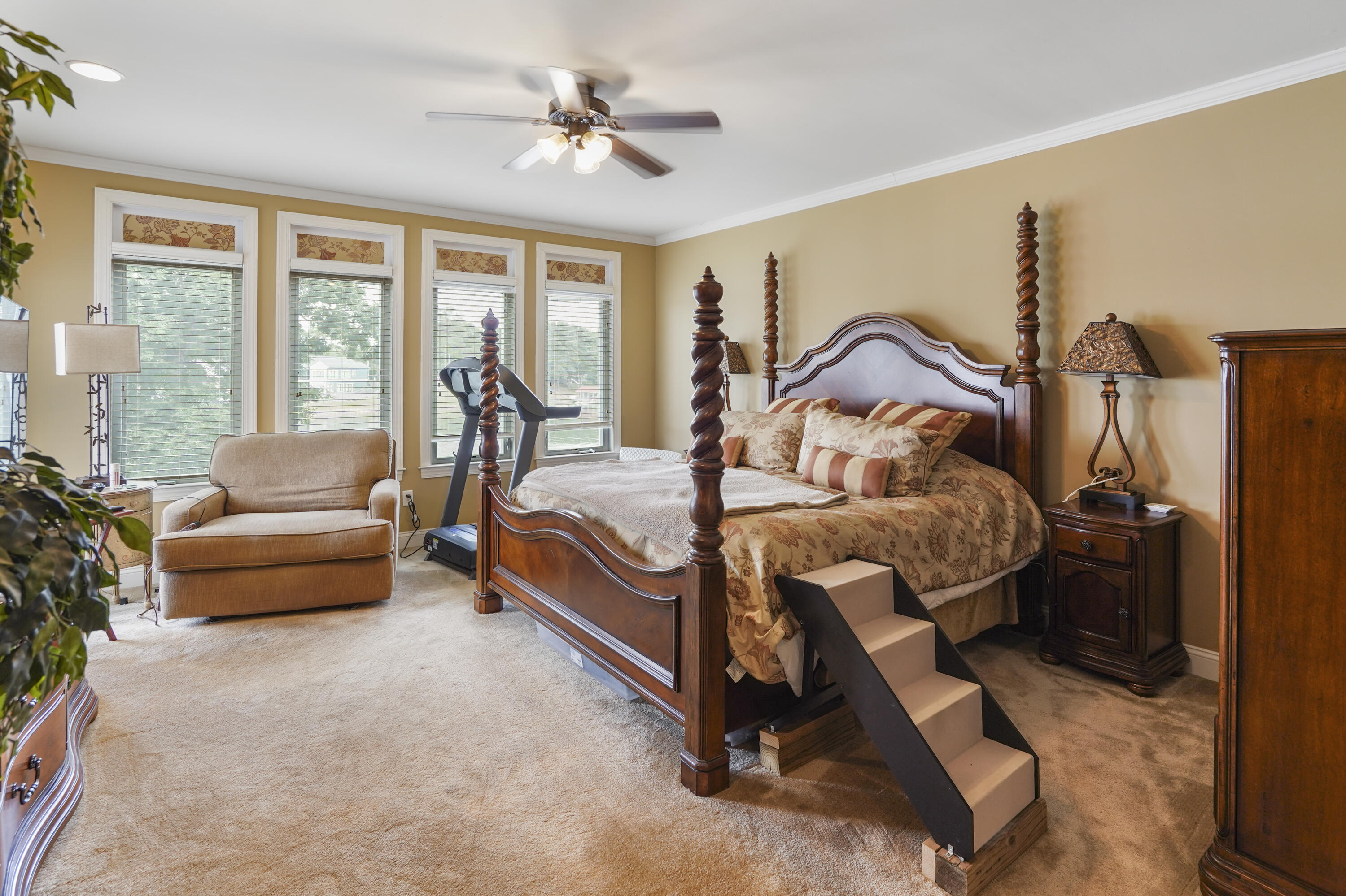 544 Wood Brook Road Moneta, VA 24121 - Photo 18 of 66 a bedroom with a bed a flat screen tv and a large window with the balcony view