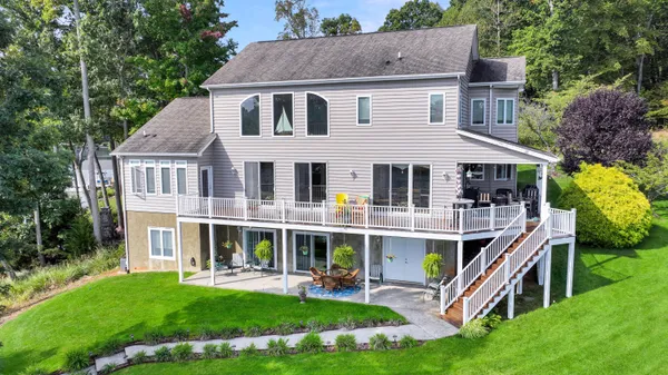 a front view of house with yard and green space