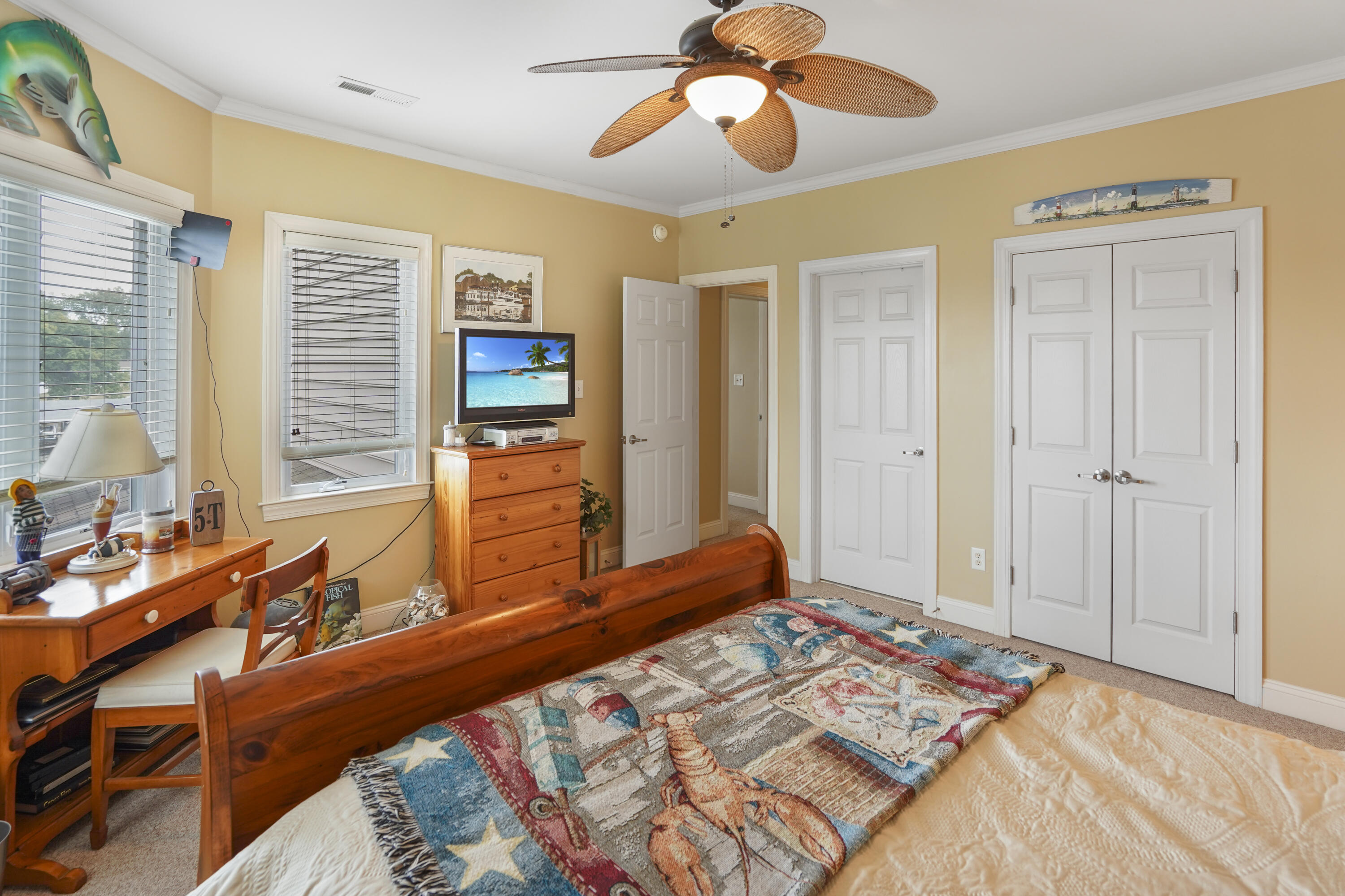 544 Wood Brook Road Moneta, VA 24121 - Photo 38 of 66 a bedroom with a bed and a chandelier