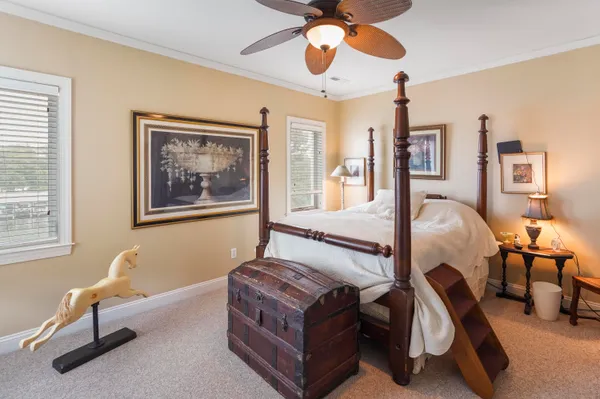 a bedroom with a bed and a desk