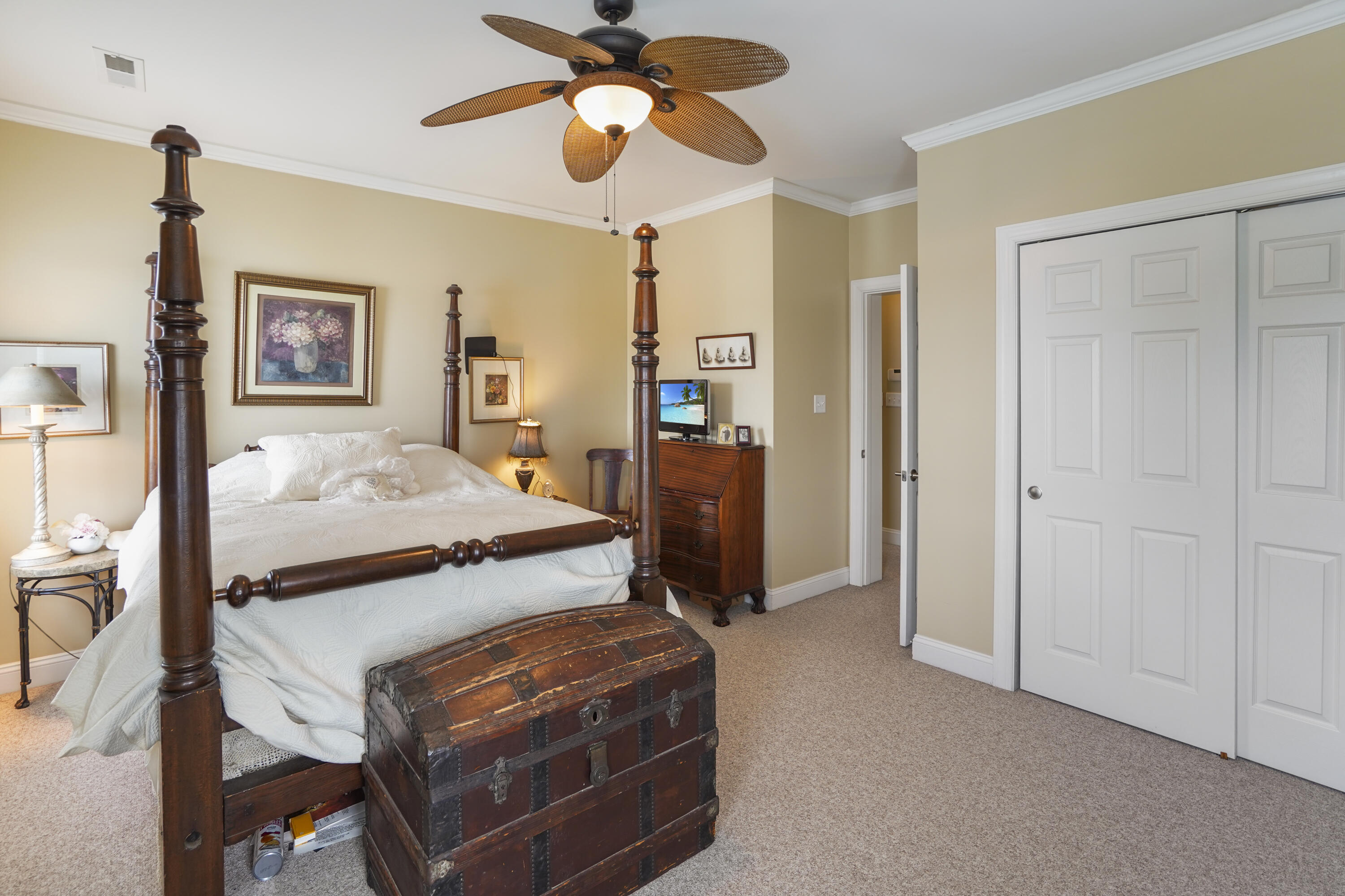 544 Wood Brook Road Moneta, VA 24121 - Photo 41 of 66 a bedroom with a bed and a chandelier