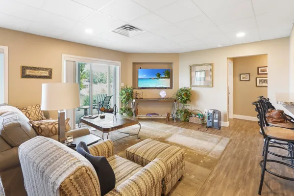 a view of a balcony with lake view and wooden floor