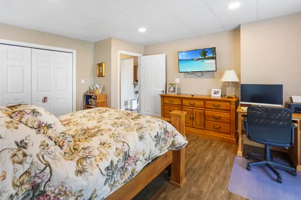 an aerial view of a house with swimming pool and lake view