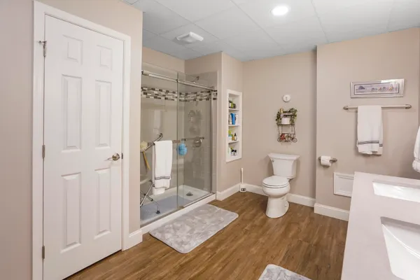 a aerial view of a house with a garden and lake view