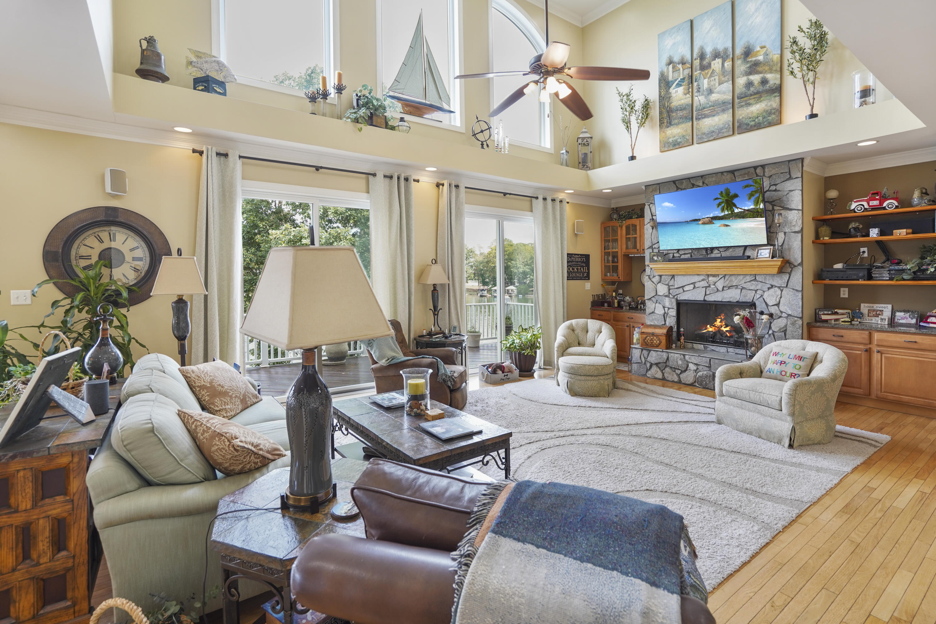 544 Wood Brook Road Moneta, VA 24121 - Photo 8 of 66 a living room with furniture a fireplace and a chandelier