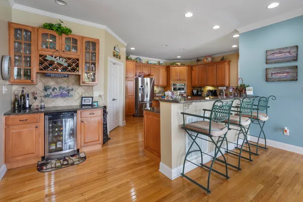 a kitchen with stainless steel appliances a refrigerator sink and cabinets