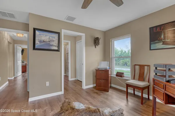 a living room with furniture flat screen tv and a fireplace