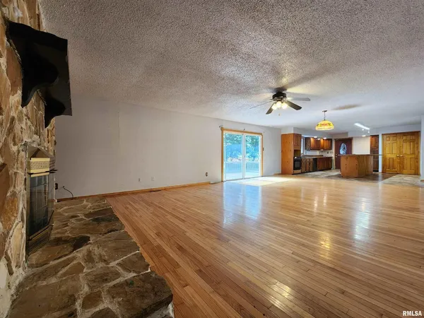 a view of a livingroom with wooden floor