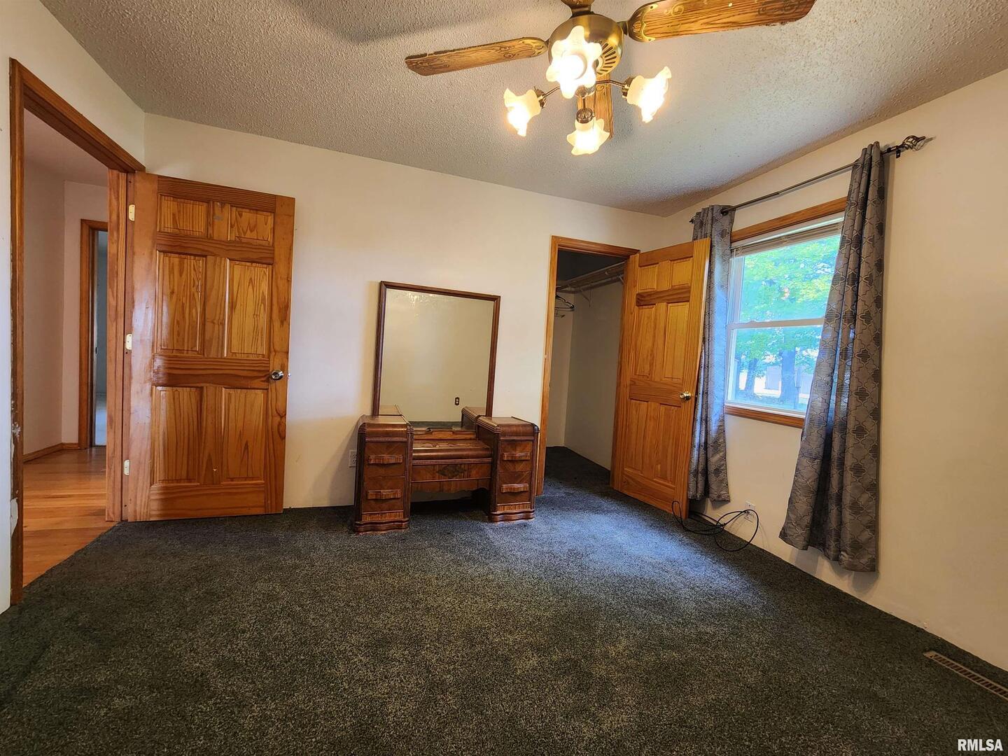 10107 Sugar Creek Road Benton, IL 62812 - Photo 20 of 43 wooden floor in an empty room with a window