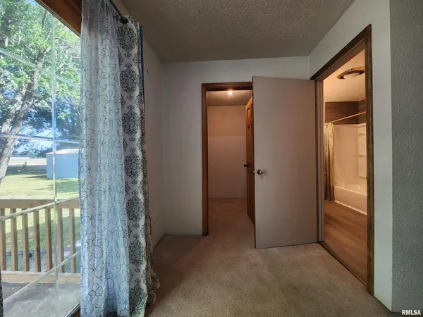 an empty room that has a sliding door