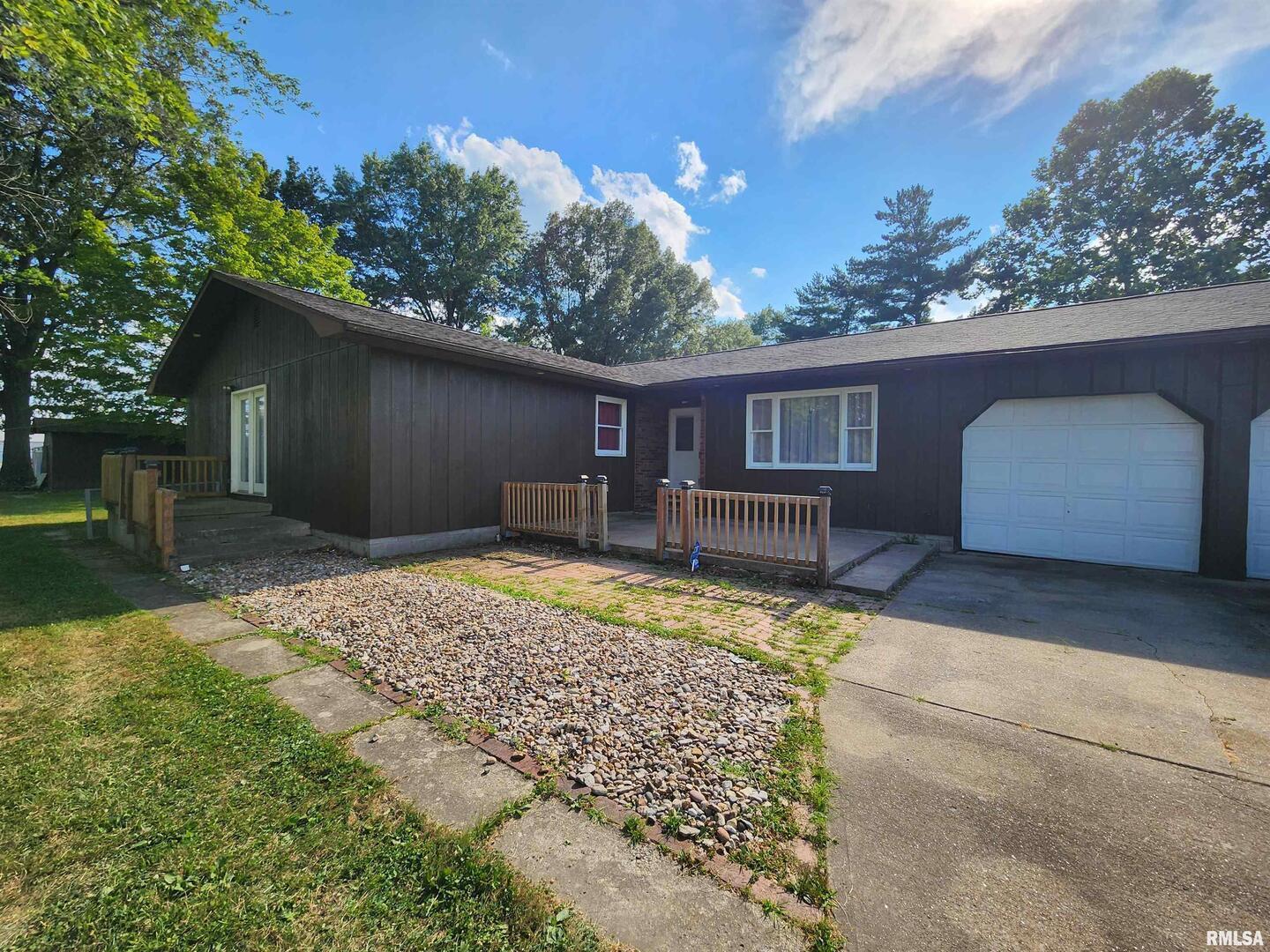 10107 Sugar Creek Road Benton, IL 62812 - Photo 32 of 43 a backyard of a house with garden and patio