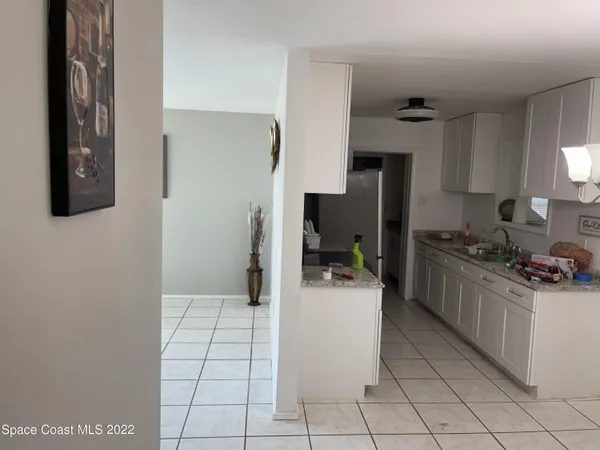 a view of an empty room and a window