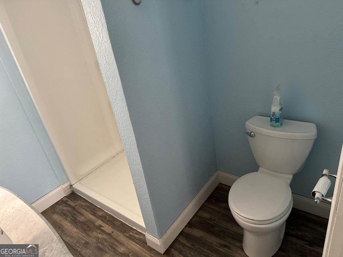 160 Macon Road McIntyre, GA 31054 - Photo 13 of 22 a bathroom with a toilet and a sink