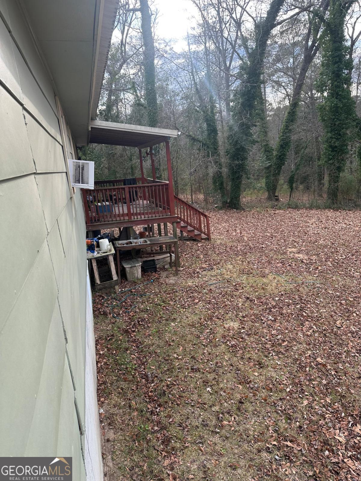 160 Macon Road McIntyre, GA 31054 - Photo 17 of 22 a view of a chairs and table in the backyard