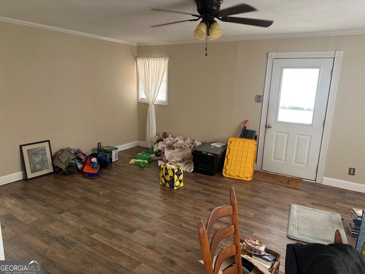160 Macon Road McIntyre, GA 31054 - Photo 2 of 22 a view of a livingroom with furniture and a wooden floor