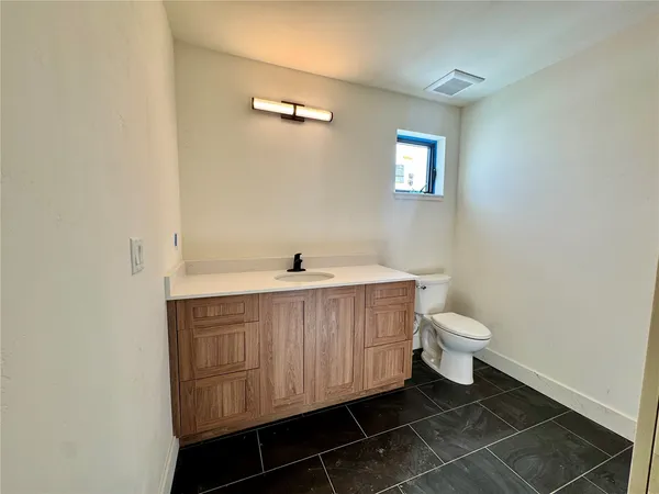 a bathroom with a sink and a toilet