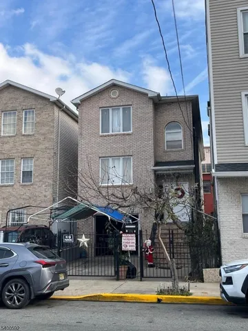 a car parked in front of a house