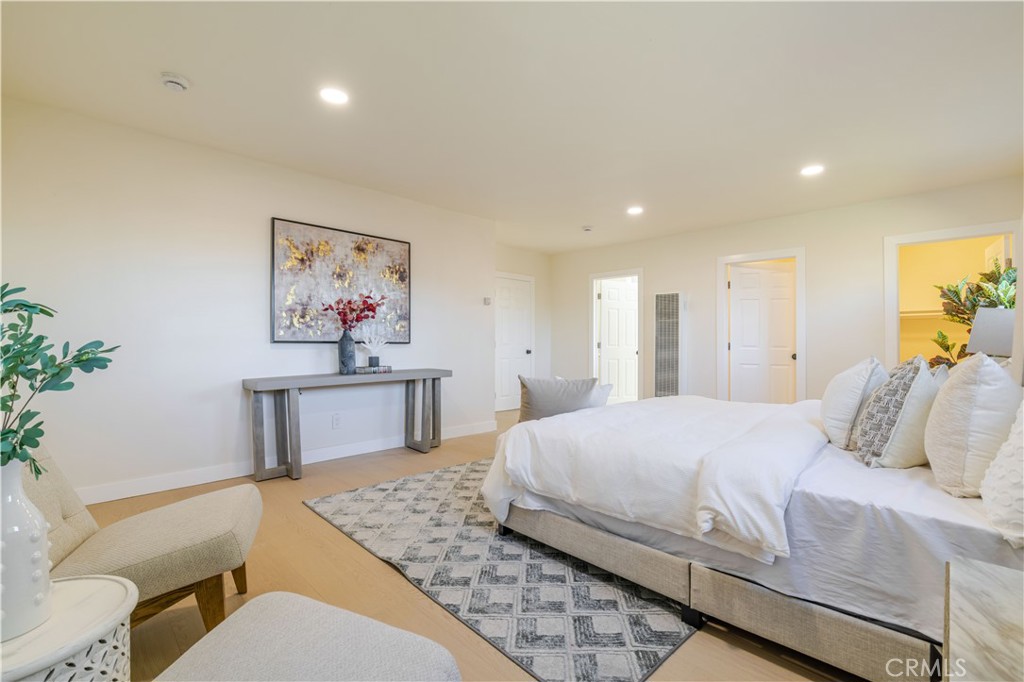 917 South Aprilia Avenue Compton, CA 90220 - Photo 11 of 24 a bedroom with a bed and a dresser