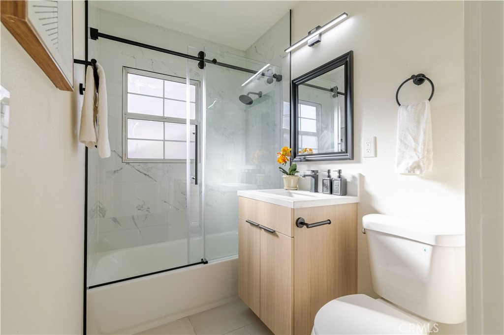 917 South Aprilia Avenue Compton, CA 90220 - Photo 18 of 24 a bathroom with a sink toilet and shower