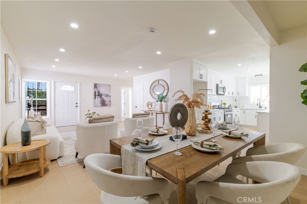 917 South Aprilia Avenue Compton, CA 90220 - Photo 2 of 24 a kitchen with a table and chairs