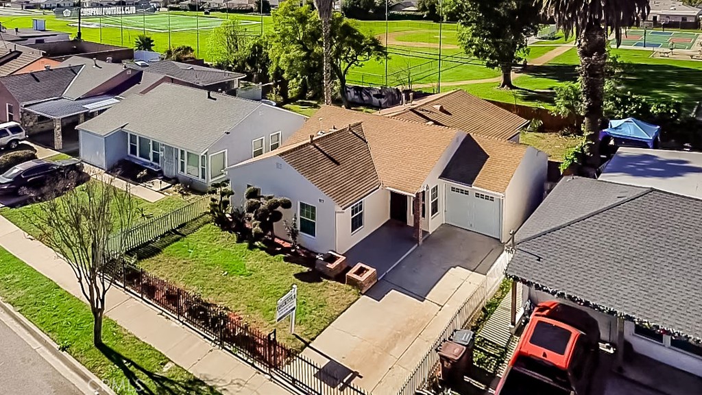 917 South Aprilia Avenue Compton, CA 90220 - Photo 22 of 24 an aerial view of a house with a garden and swimming pool