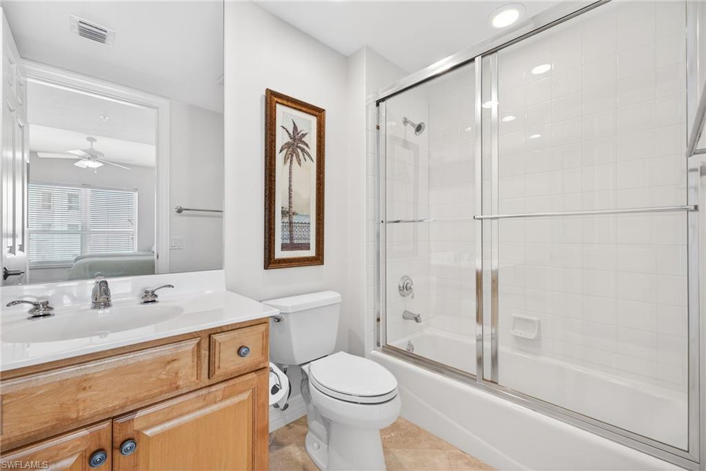 295 Grande Way, Unit 901 Naples, FL 34110 - Photo 22 of 50 a bathroom with a sink toilet and shower