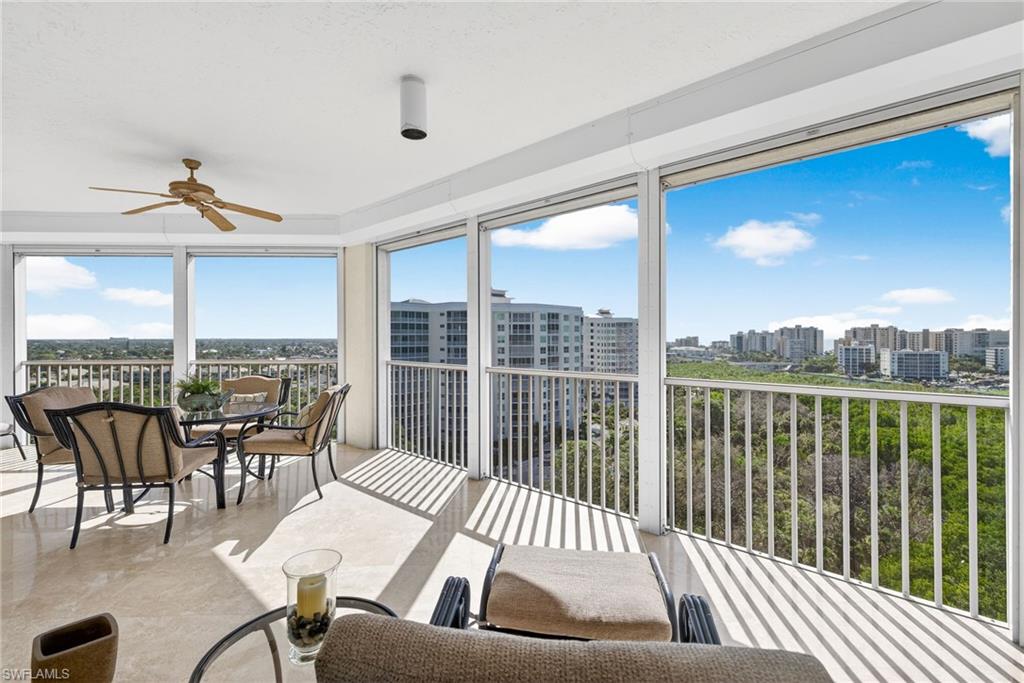 295 Grande Way, Unit 901 Naples, FL 34110 - Photo 28 of 50 a view of a balcony with furniture and floor to ceiling window