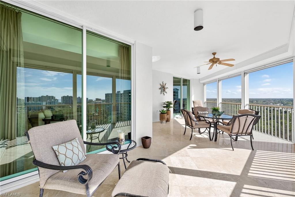 295 Grande Way, Unit 901 Naples, FL 34110 - Photo 29 of 50 a view of a dining room with furniture window and outside view