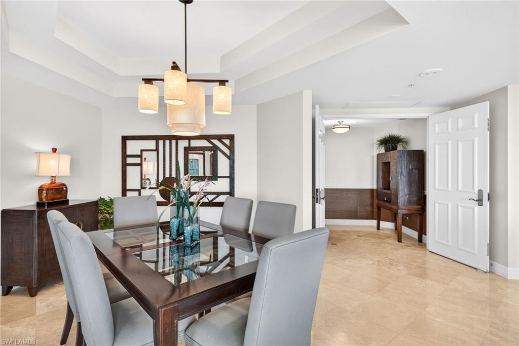 295 Grande Way, Unit 901 Naples, FL 34110 - Photo 10 of 50 a view of a dining room with furniture
