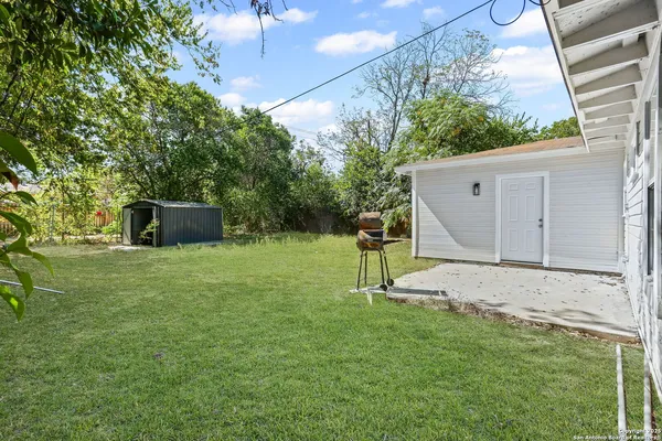 a house view with a backyard space