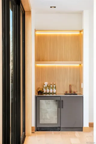a view of a kitchen with furniture and stairs