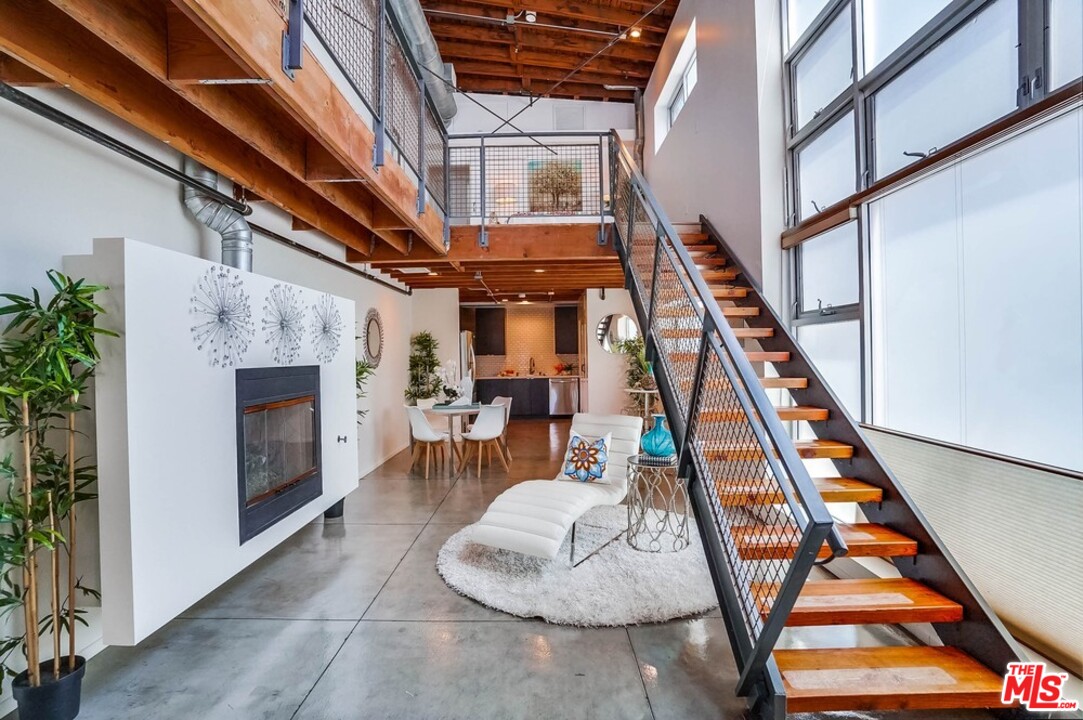 849 Pine Avenue Long Beach, CA 90813 - Photo 1 of 39 a view of an entryway with wooden floor and a fire pit