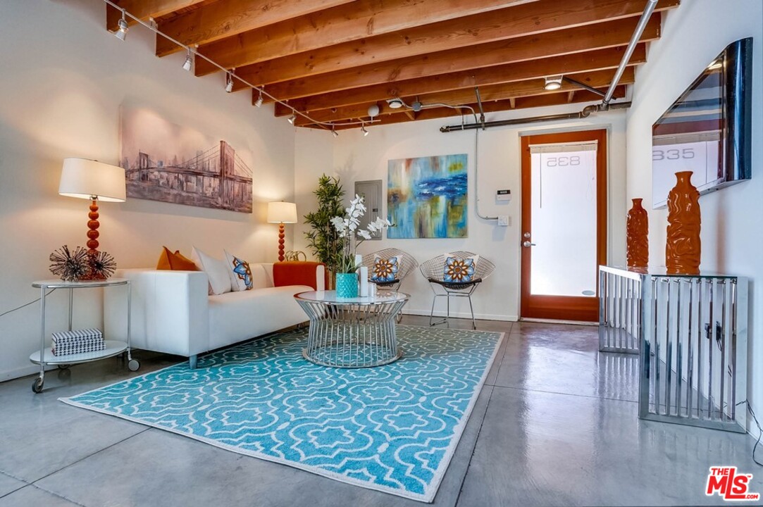 849 Pine Avenue Long Beach, CA 90813 - Photo 22 of 39 a living room with furniture and a chandelier