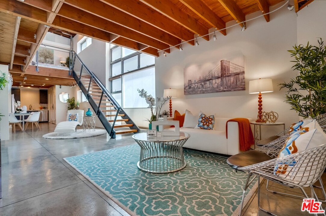 849 Pine Avenue Long Beach, CA 90813 - Photo 9 of 39 a living room with chairs and kitchen view