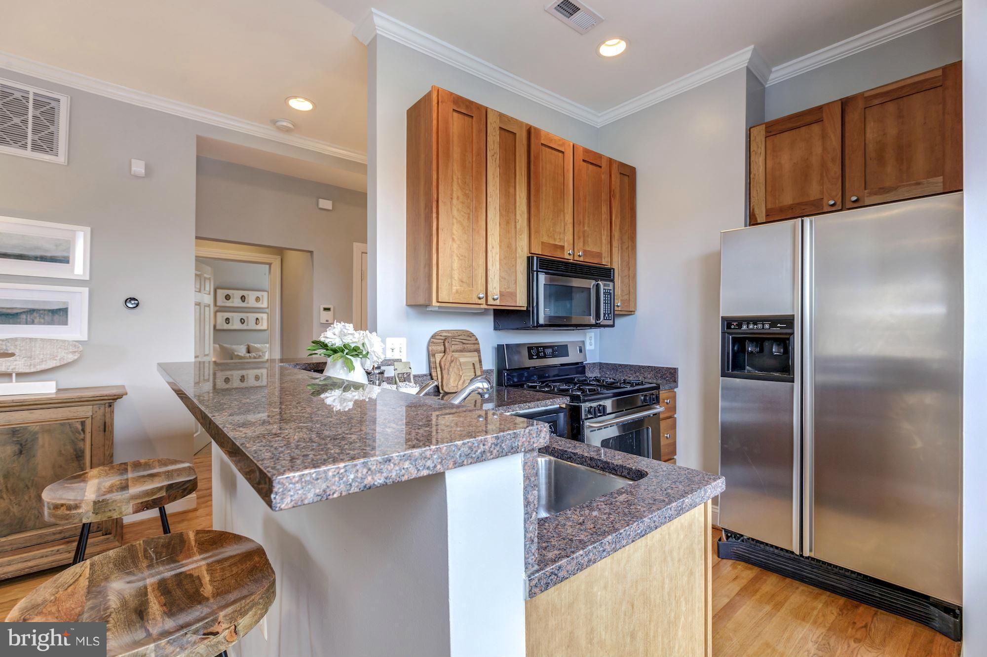 1306 O Street Northwest, Unit 201 Washington, DC 20005 - Photo 5 of 14 Kitchen with Breakfast Bar