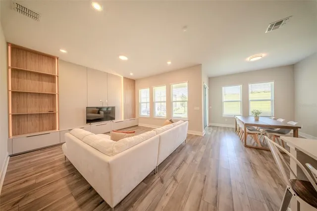 a living room with furniture and a large window