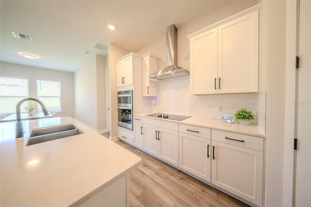 a bedroom with a bed and flat screen tv
