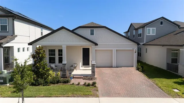 a front view of a house with a yard and porch