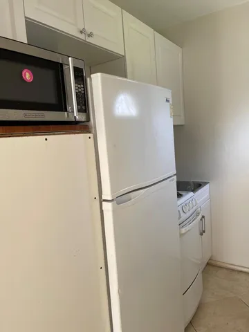 a view of a livingroom with an empty space and window