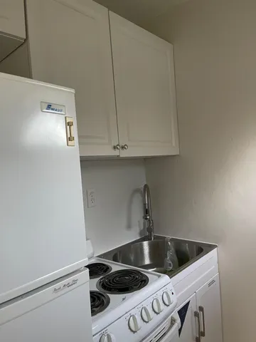 a view of kitchen and microwave