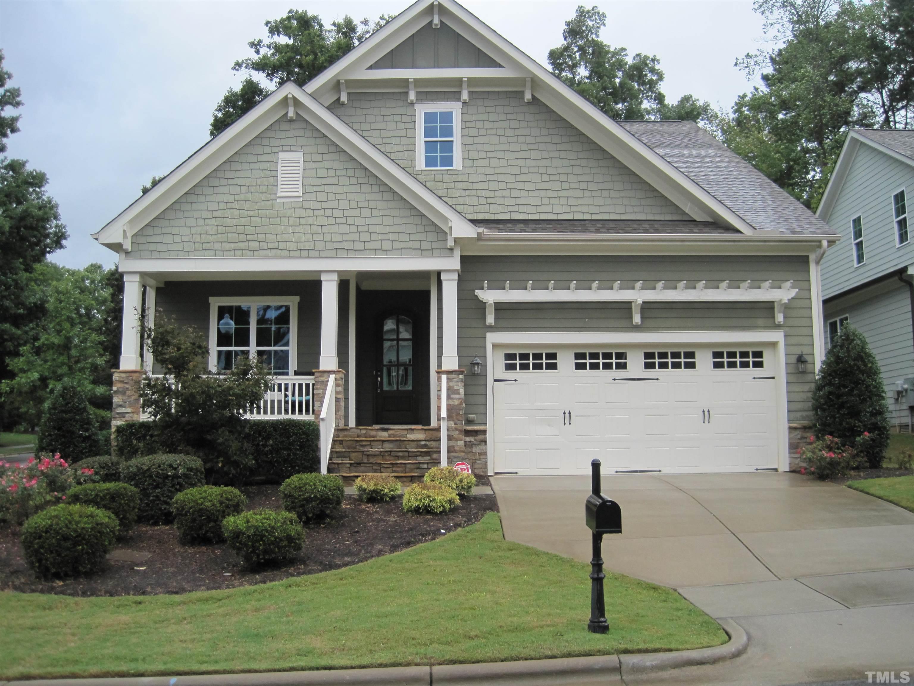 8035 Brandyapple Drive Raleigh, NC 27615 - Photo 2 of 30 Front Porch with stone steps, columns, arched solid mahogany front door with bevel glass.