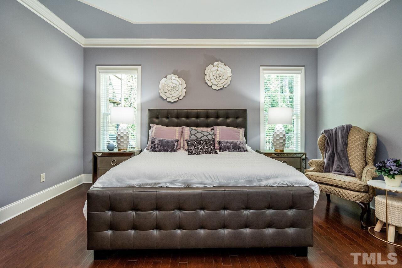 8035 Brandyapple Drive Raleigh, NC 27615 - Photo 14 of 30 Spacious Owners Suite with ceiling detail, two piece crown and hardwood floors.