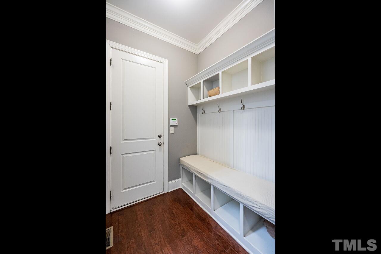 8035 Brandyapple Drive Raleigh, NC 27615 - Photo 22 of 30 Back entrance foyer with storage bench.