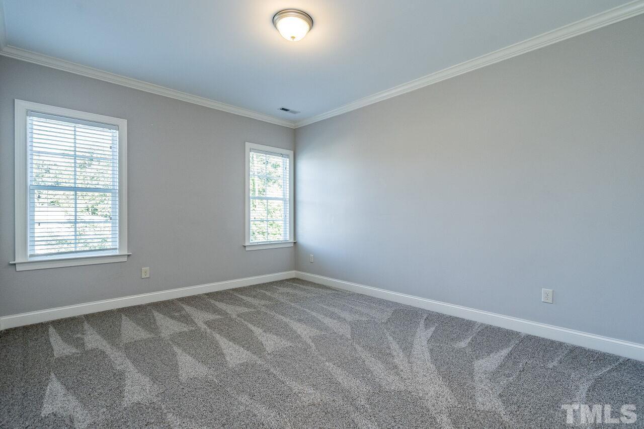 8035 Brandyapple Drive Raleigh, NC 27615 - Photo 24 of 30 Second floor bedroom with private access door to hall bath and new carpet.