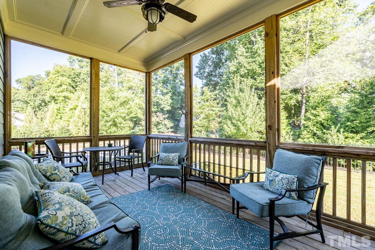 8035 Brandyapple Drive Raleigh, NC 27615 - Photo 27 of 30 Screen Porch with detailed ceiling and ceiling fan.