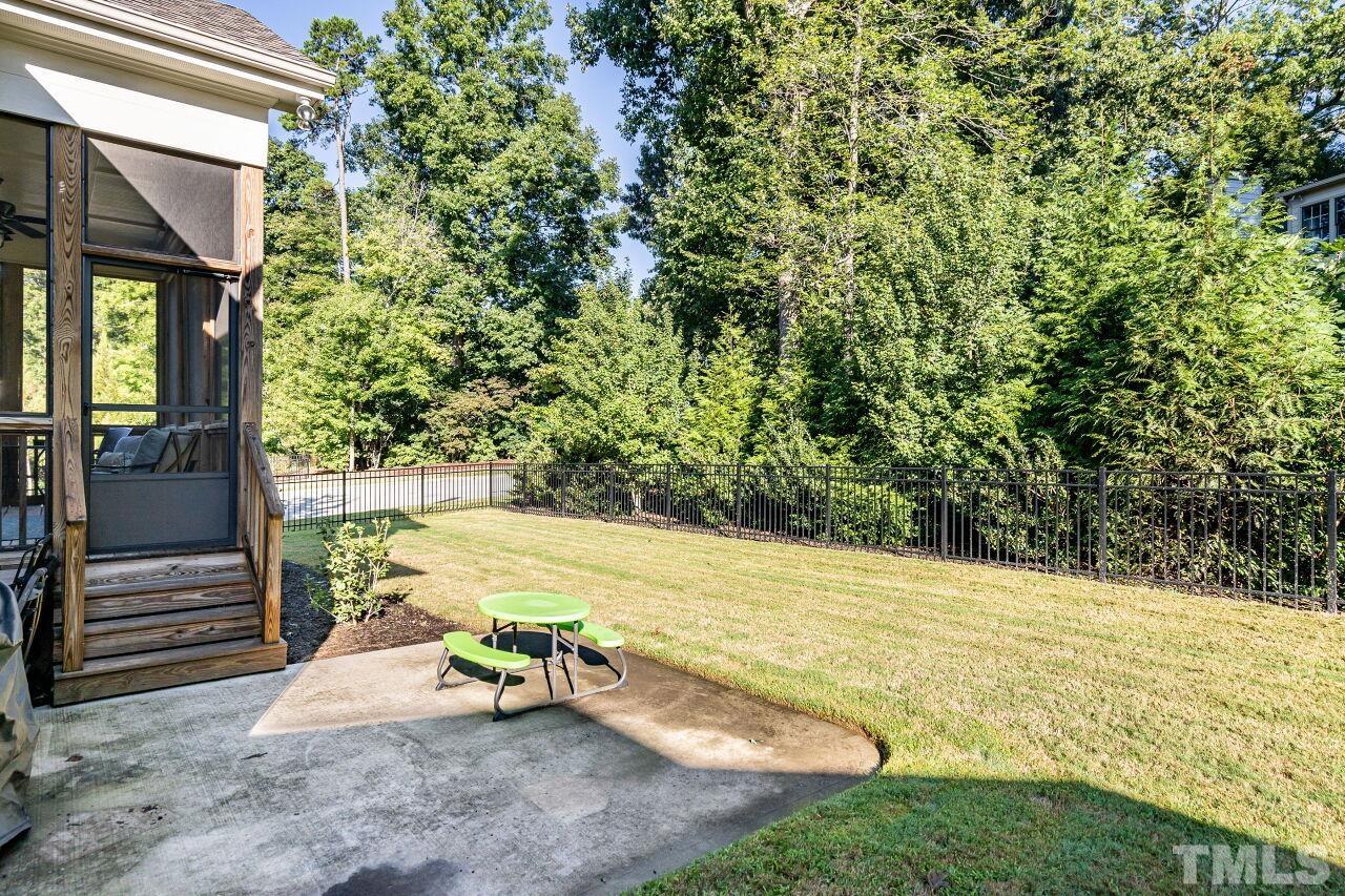 8035 Brandyapple Drive Raleigh, NC 27615 - Photo 29 of 30 Screen porch, patio and fenced back yard.
