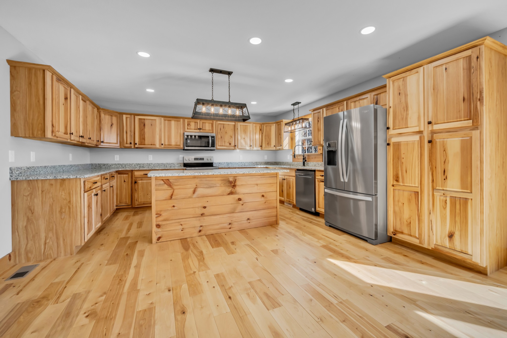 718 Darrell Rye Road Erin, TN 37061 - Photo 13 of 38 a kitchen with stainless steel appliances granite countertop a refrigerator a sink dishwasher a stove and a wooden cabinets