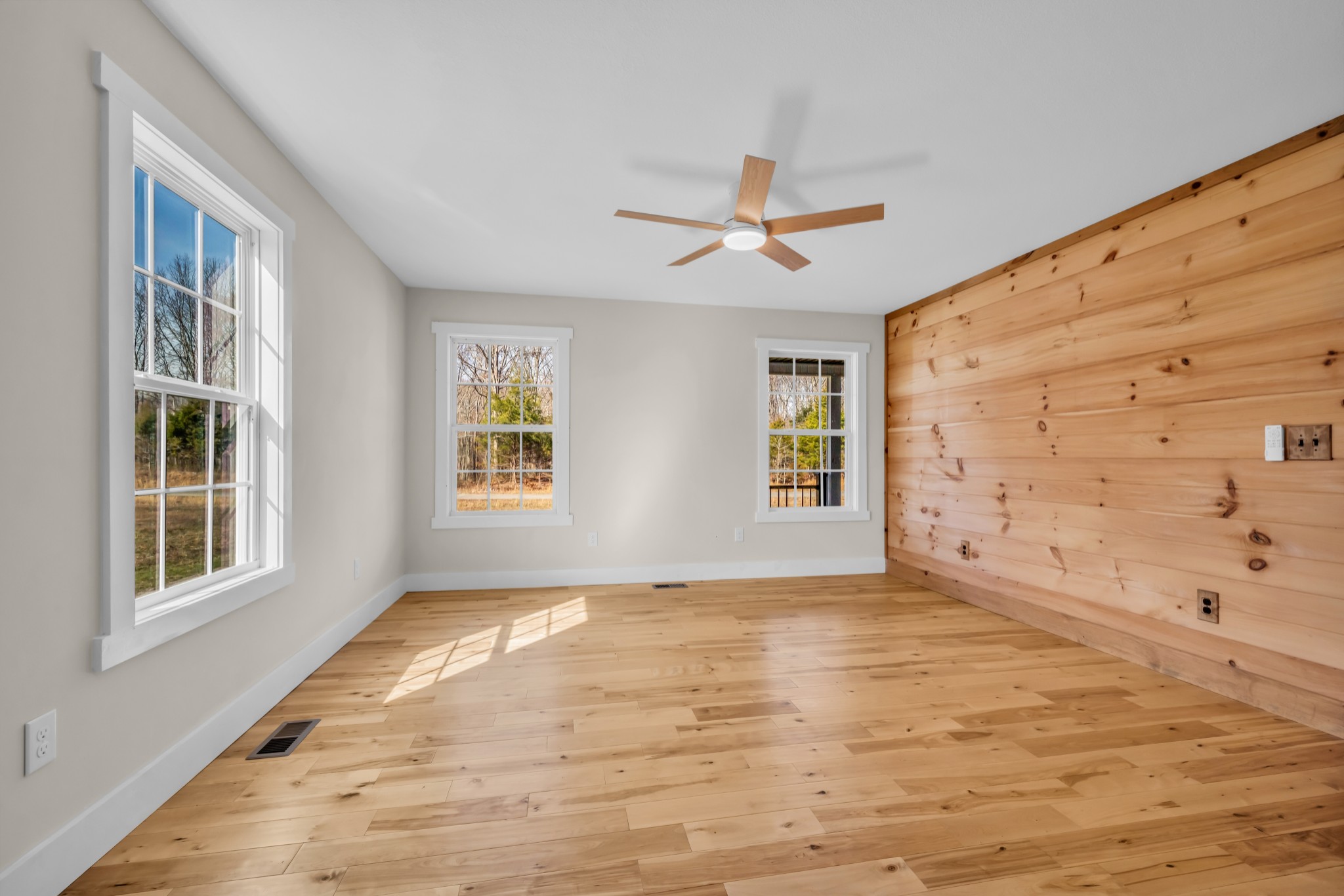 718 Darrell Rye Road Erin, TN 37061 - Photo 20 of 38 a view of an empty room with a window and wooden floor