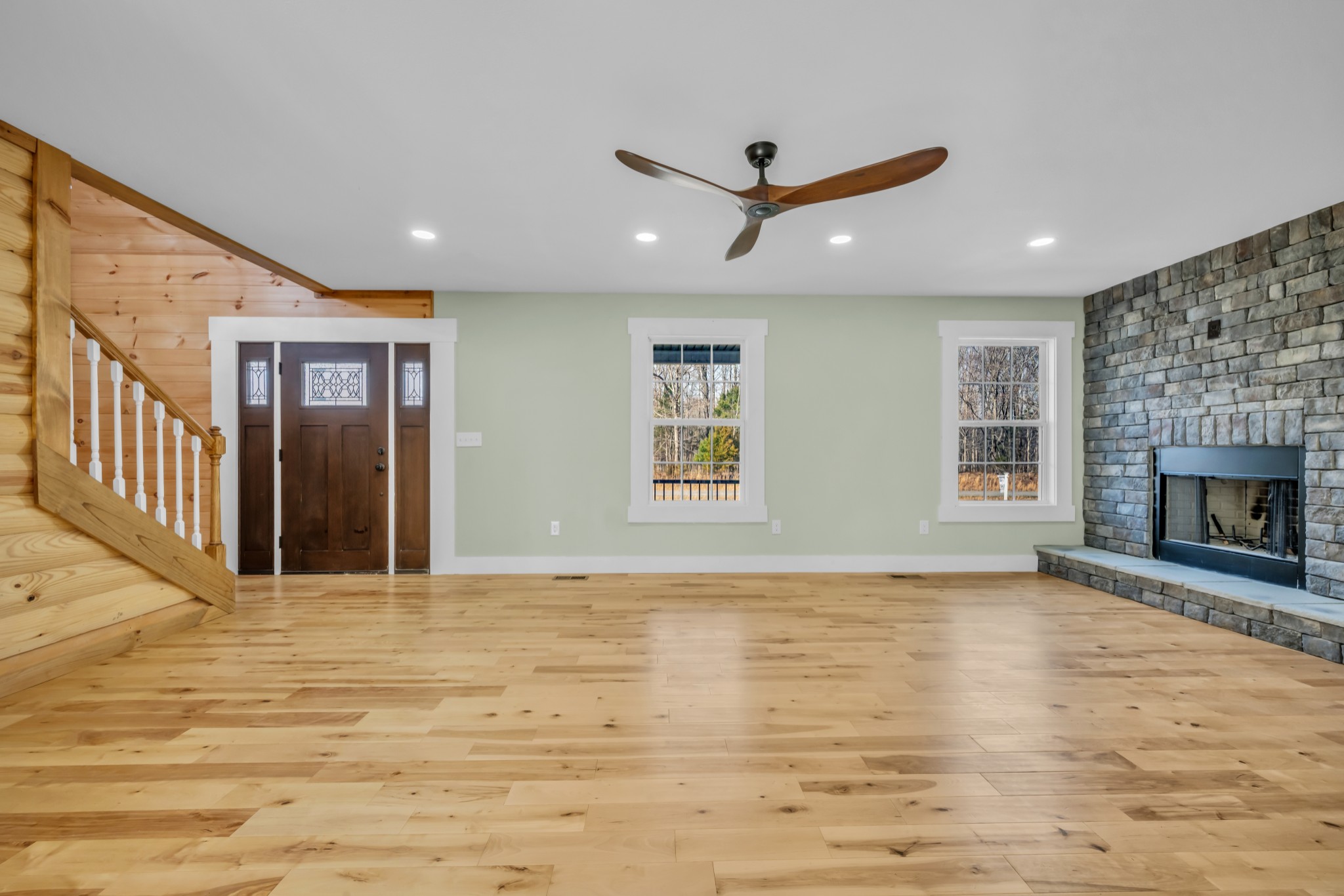 718 Darrell Rye Road Erin, TN 37061 - Photo 2 of 38 a view of an empty room with wooden floor and a window