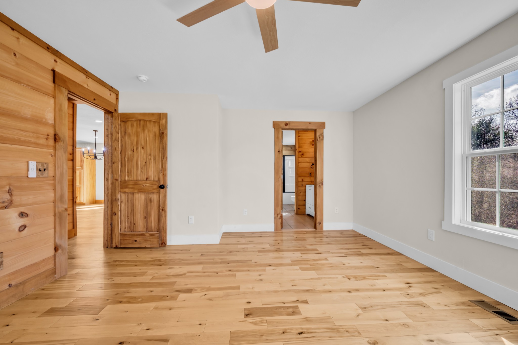 718 Darrell Rye Road Erin, TN 37061 - Photo 29 of 38 a view of an empty room with wooden floor and a window